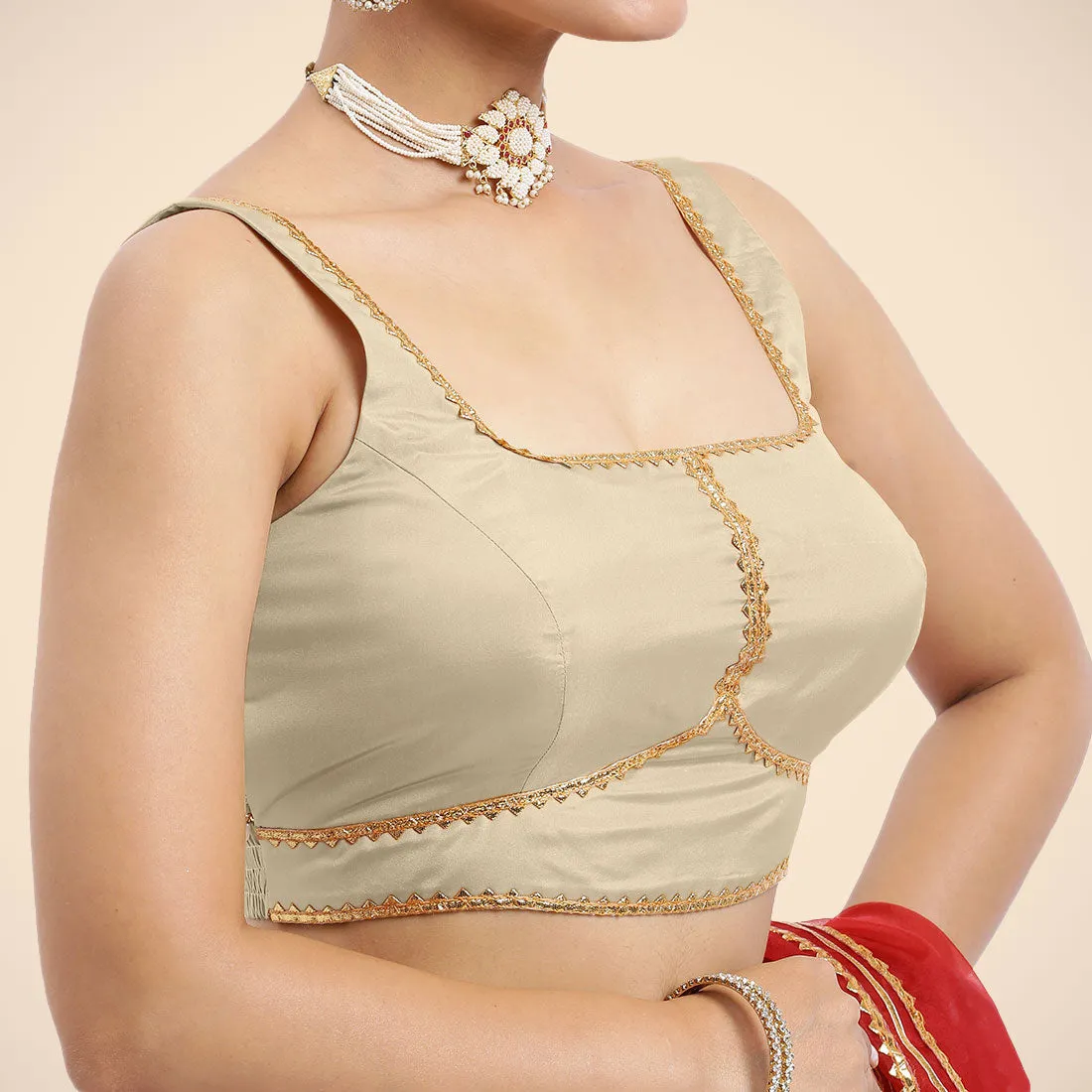 Arya x Tyohaar | Cream Sleeveless FlexiFit™ Saree Blouse with Square Neck and Back Window Embeliished with Golden Gota and Pearl Lace