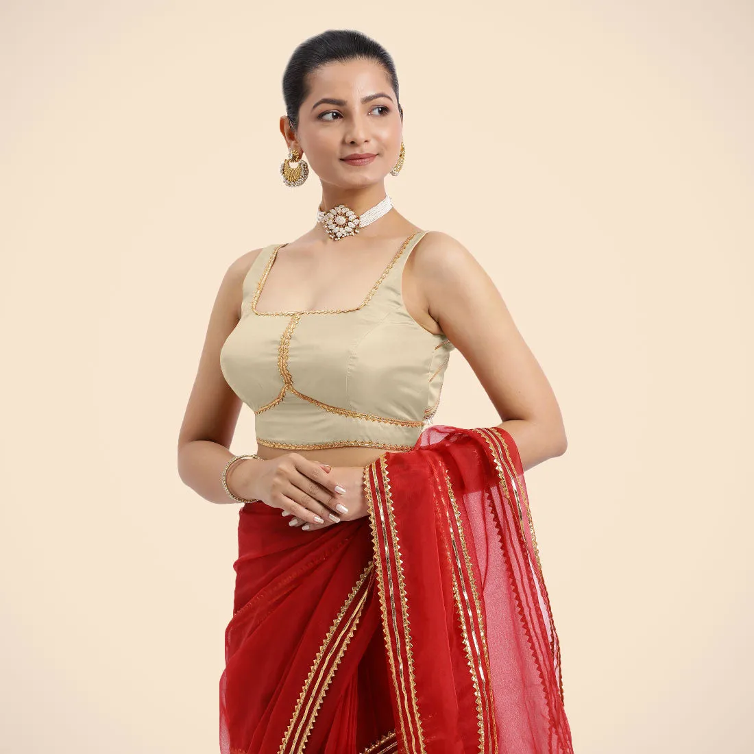 Arya x Tyohaar | Cream Sleeveless FlexiFit™ Saree Blouse with Square Neck and Back Window Embeliished with Golden Gota and Pearl Lace