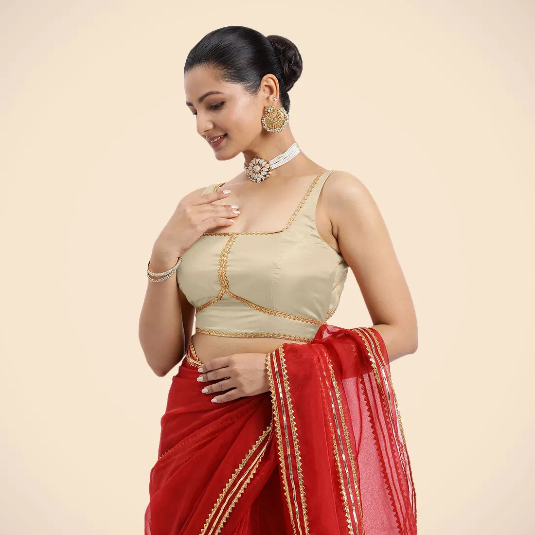 Arya x Tyohaar | Cream Sleeveless FlexiFit™ Saree Blouse with Square Neck and Back Window Embeliished with Golden Gota and Pearl Lace