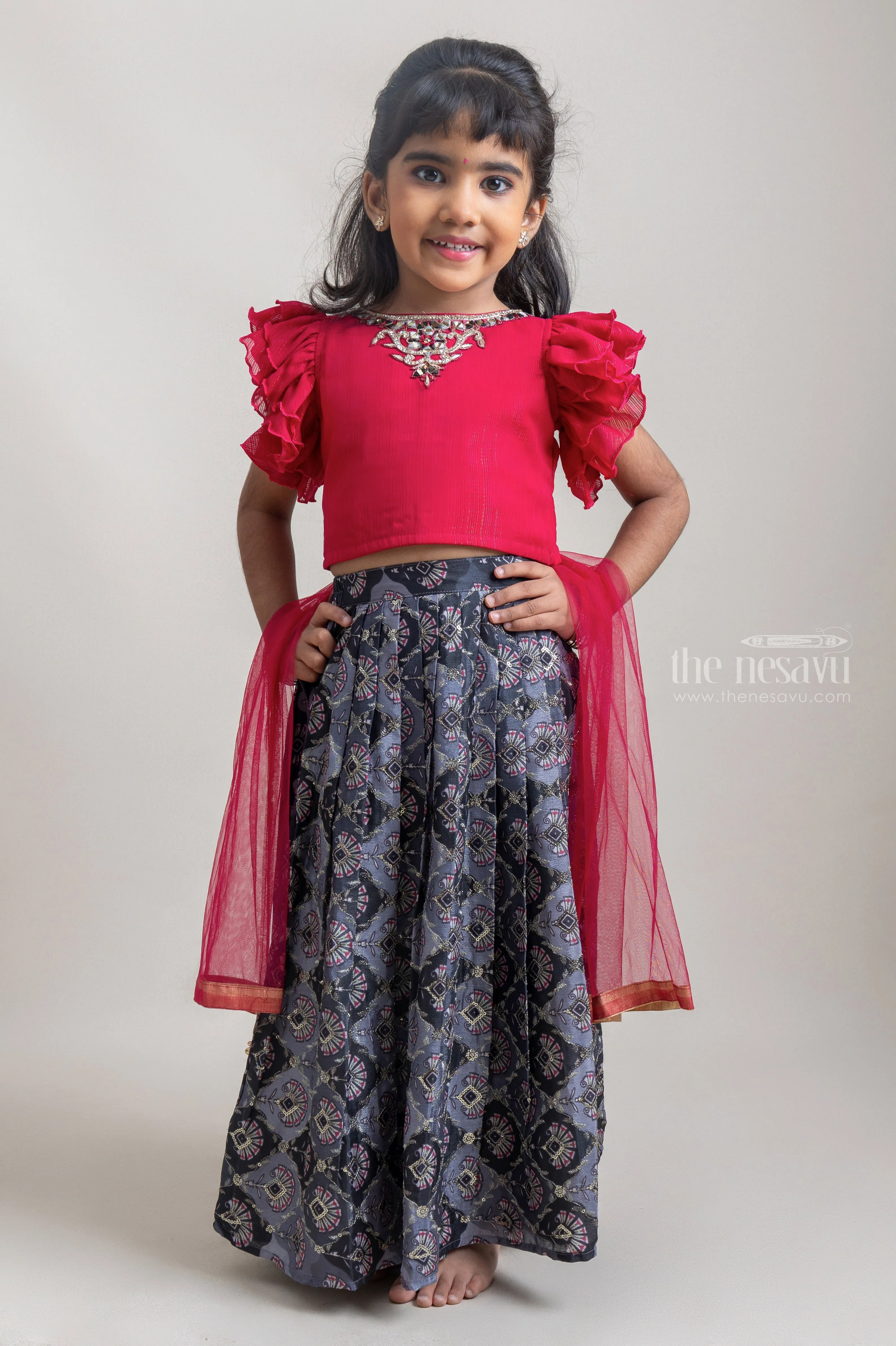 Beautiful Neckless Embroidered Red Ruffled Top And Green Floral Printed Skirt For Girls