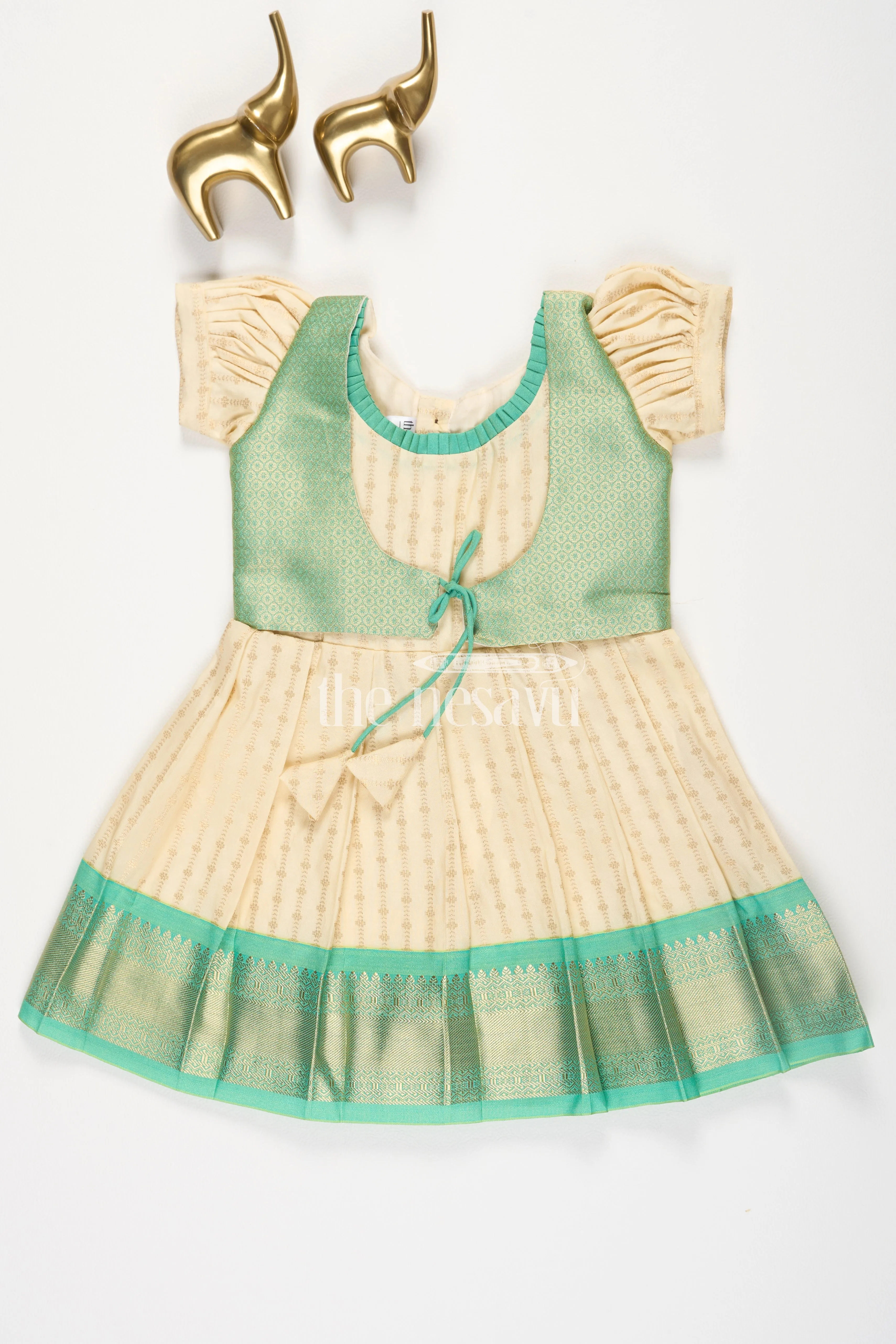 Cream and Green Semi Kanchivaram Silk Frock with Golden Stripes and Brocade Border for Girls